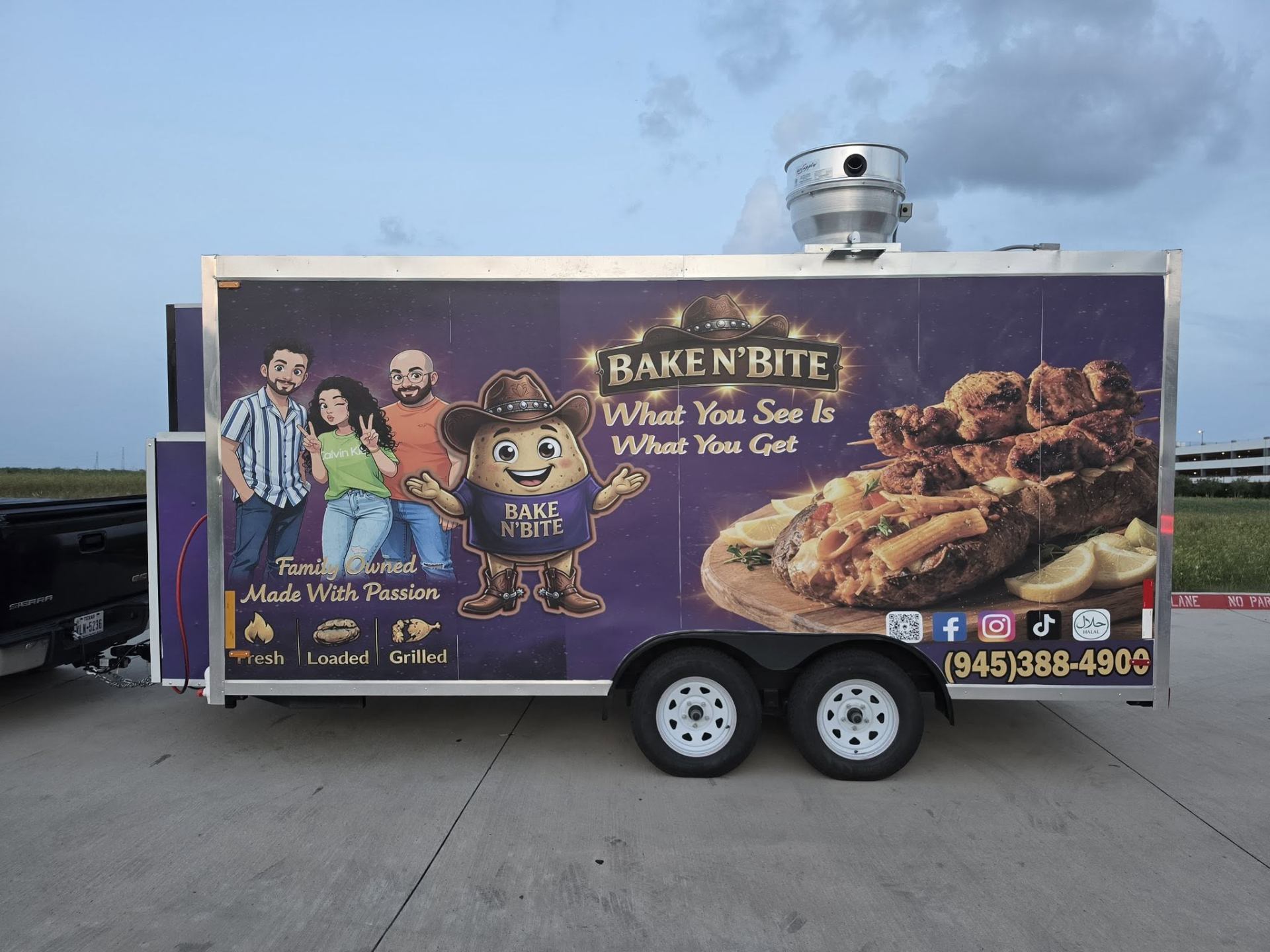 Kumpir Bake n' Bite food trailer side wrap featuring the family, mascot, and 'What You See Is What You Get' tagline